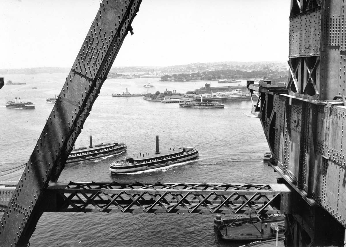 Sydney ferry KOOMPARTOO and others during construction of Sydney Harbour Bridge (1930)