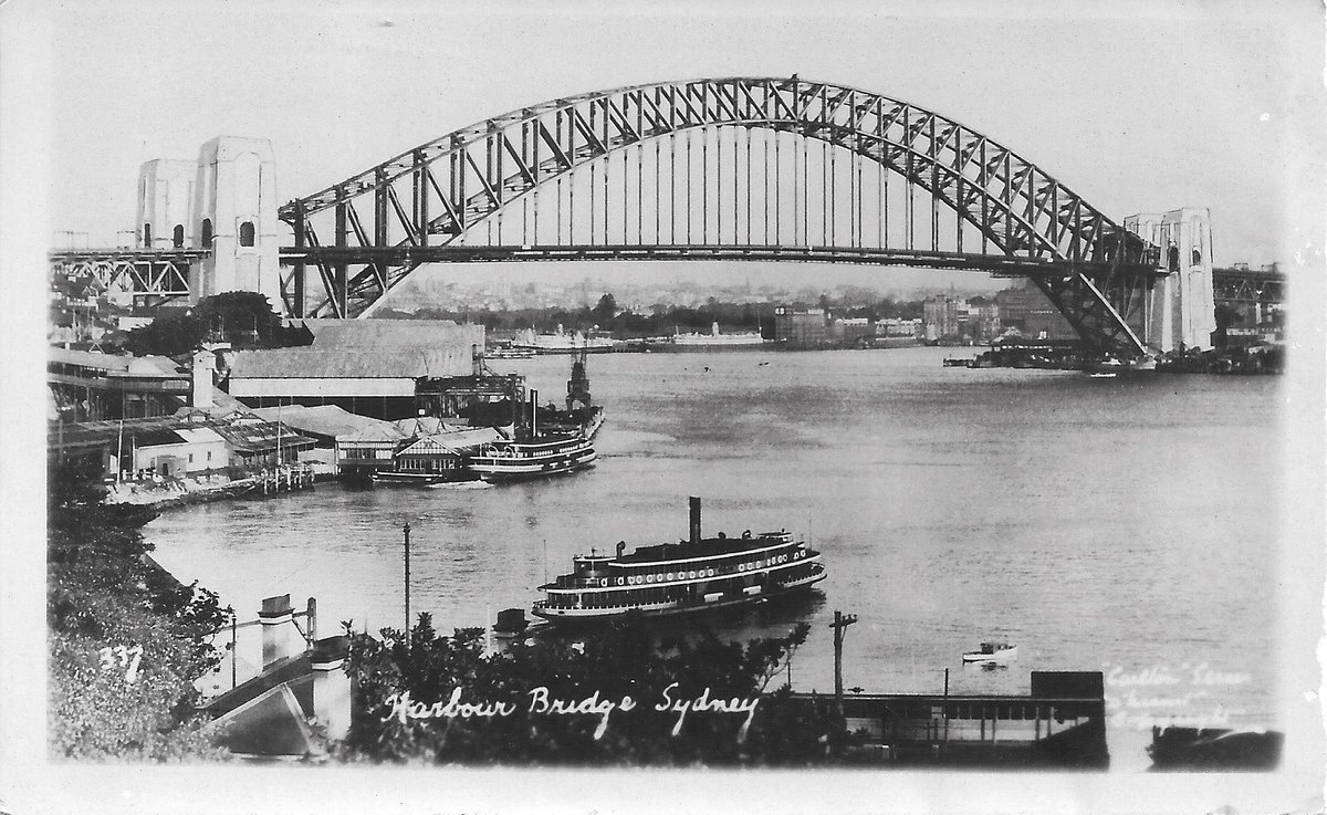 Sydney ferries KAI KAI and KUTTABUL in Lavender Bay Sydney Harbour Bridge almost complete (c. 1931)