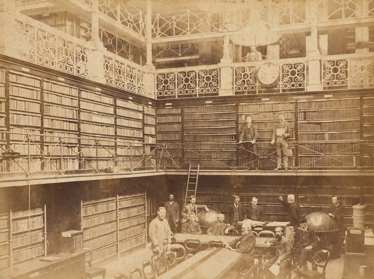 Staff inside the Free Public Library (old State Library of New South Wales), c. 1885, Sydney city centre