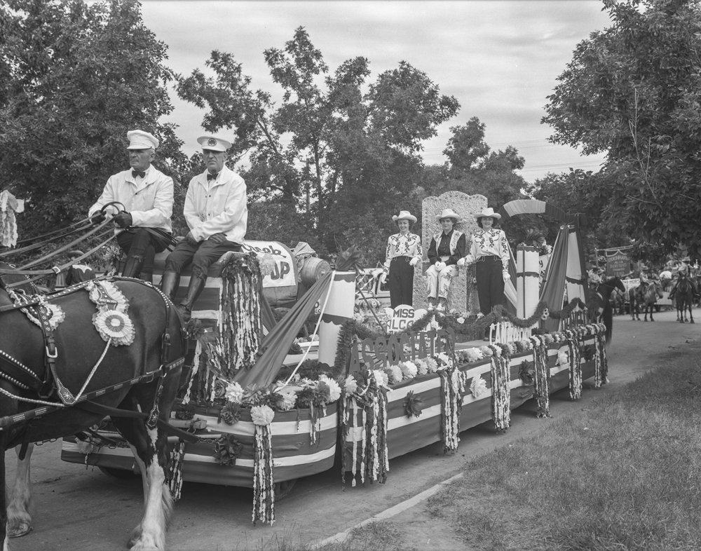 ACT (Association of Canadian Travellers) parade, 1950 (Association of Canadian Travellers parade float featuring 1948 Miss Calgary Stampede Gloria Klaver and Ladies-in-Waiting Margaret Forsgren and Shirley Kemp (1948–50)