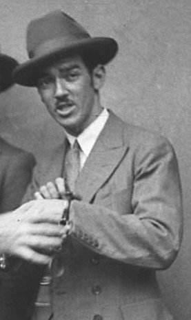 Murray the Escapologist second from right has handcuffs fitted by detectives (cropped) (1928)
