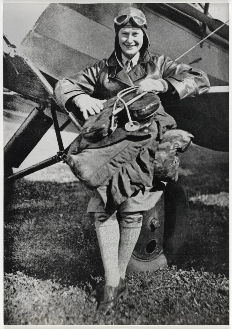 Nancy Bird 1933 on wheel of Metal Moth VH-VOP belonging to Tommy Petherbridge, Sydney city centre
