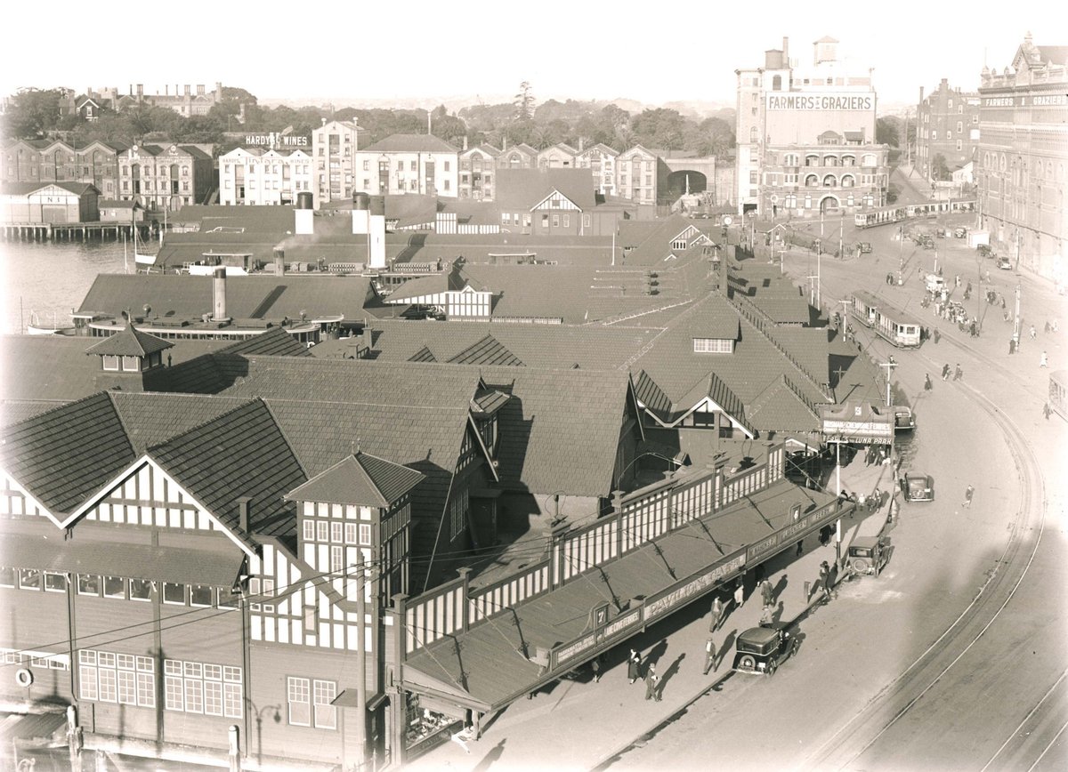 View of ferry wharves and surrounding area at Circular Quay (c. 1955)