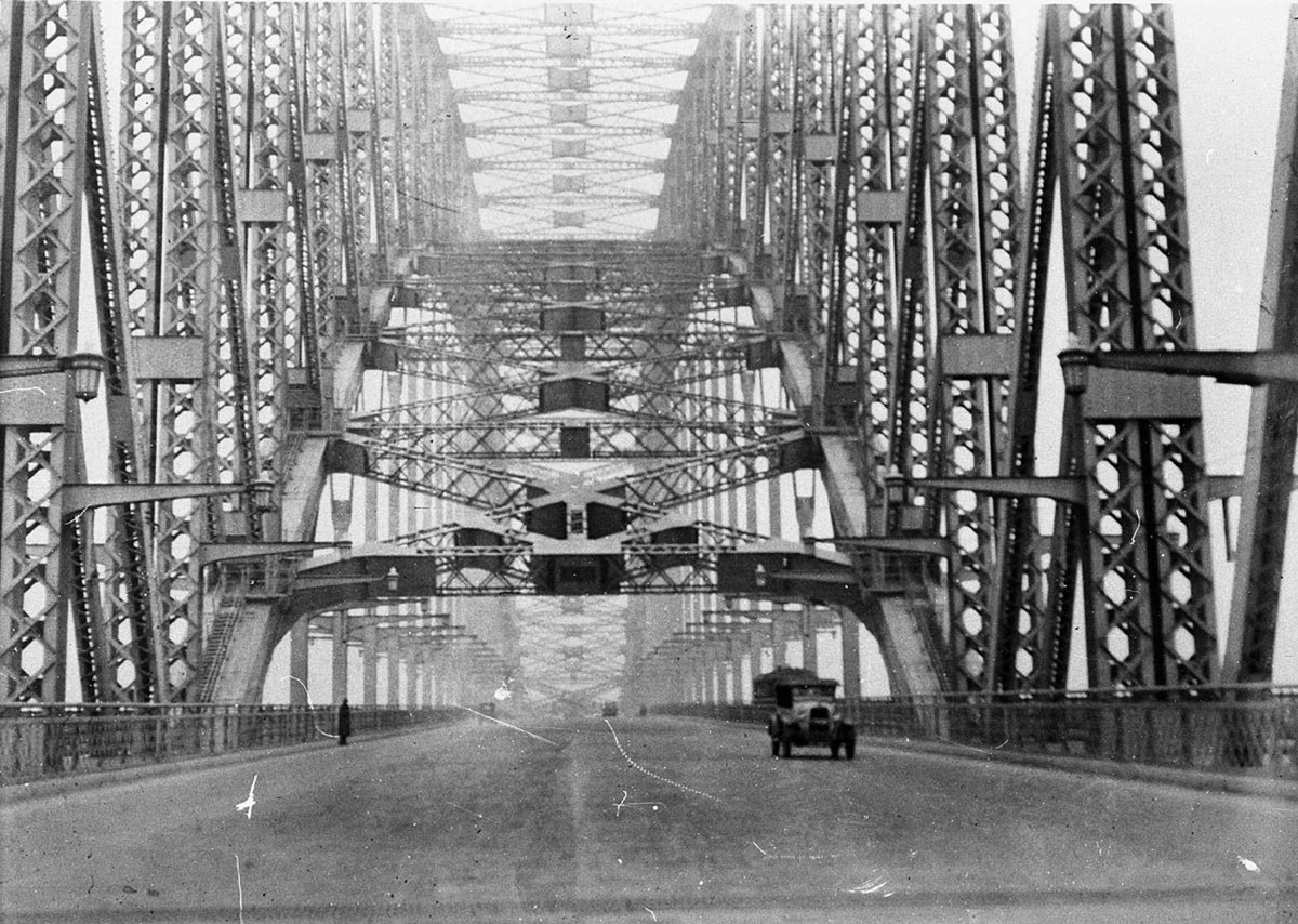 A 1923 Chevrolet one of three lonely early vehicles to cross the Bridge (1932)