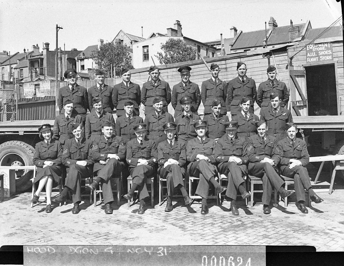 A group of twentyfive RAAF Stores personnel four RAAF officers and one WAAAF officer and other ranks for Transport Group FO Darvall (1944)