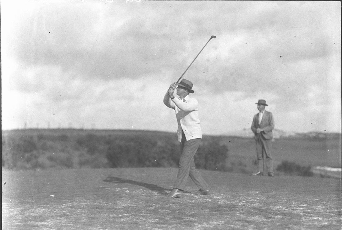 A player driving along the fairway (1930s)