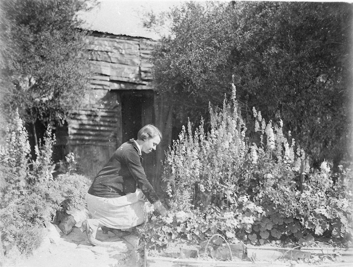 A woman tending her garden at Happy Valley (1930s)