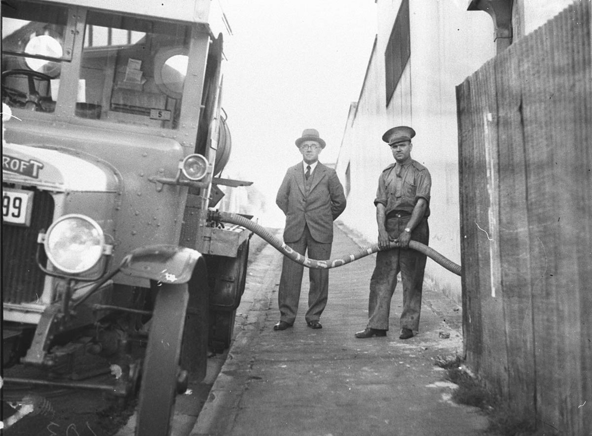 An early Shell refuelling tanker filling the tanker at Shell depot a Thornycroft vehicle (1920s)