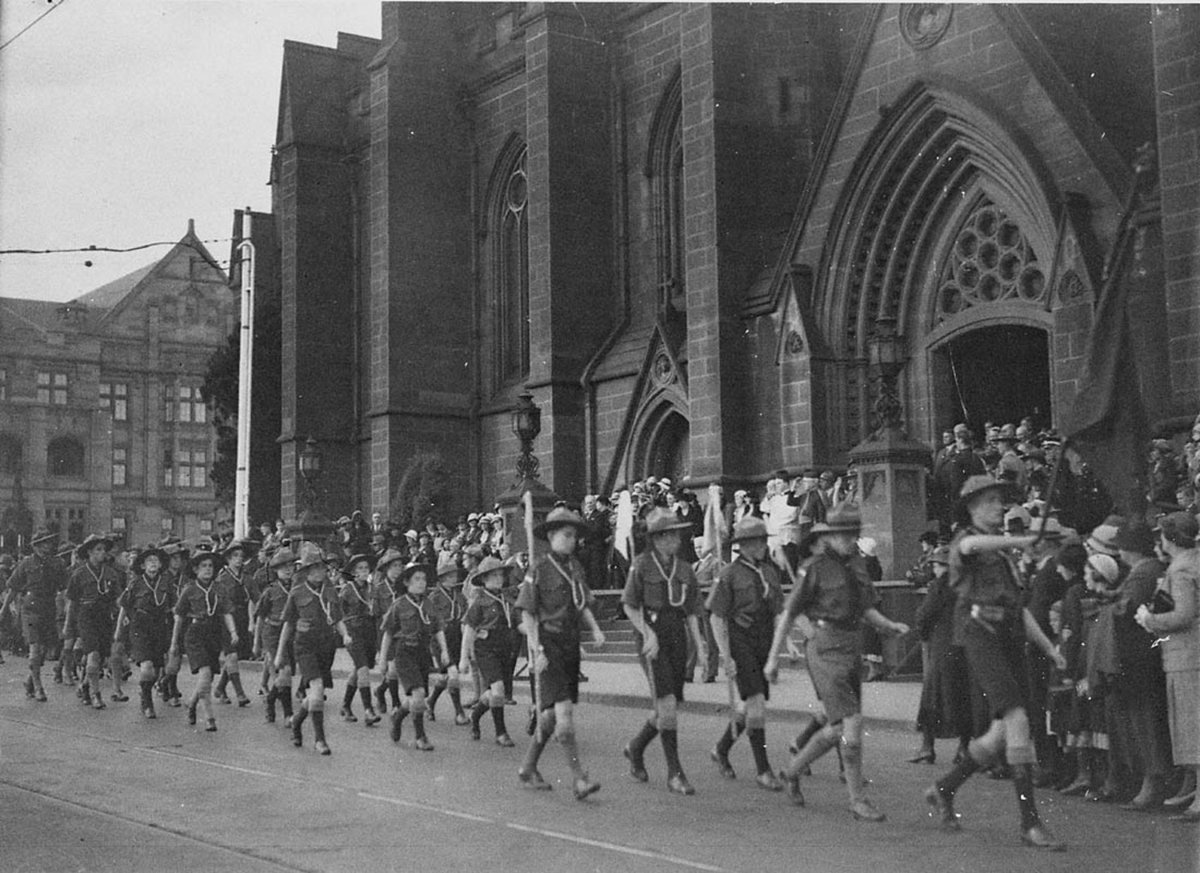 Boy scouts march past St Marys Cathedral, Sydney city centre (1930s)