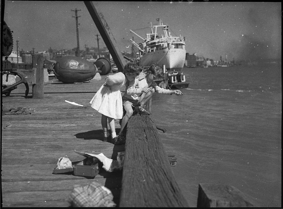 Brother and sister fishing Kings Wharf (1956)