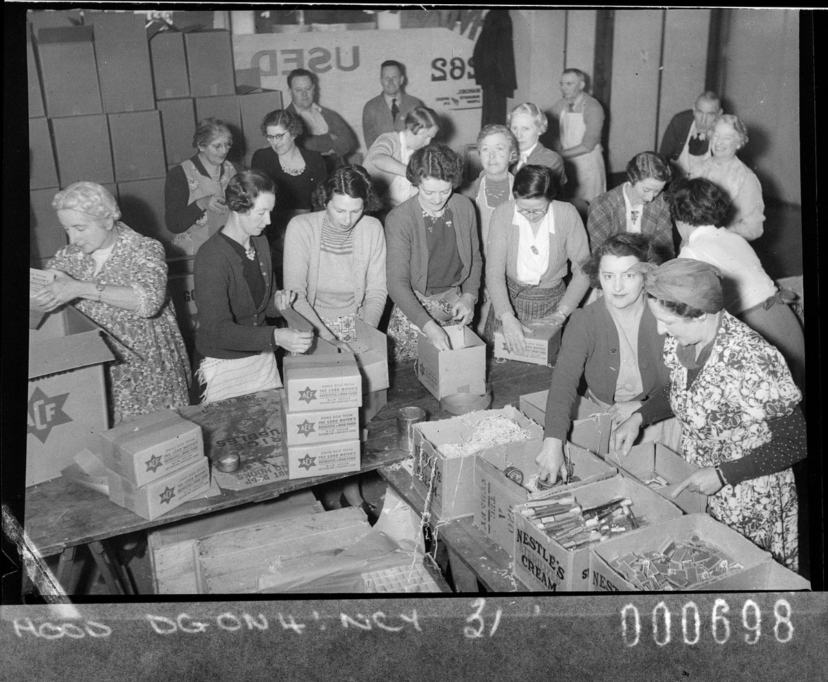 Camp Library Service packing food cartons for Australian servicemen taken for Australian Comforts Fund, Parramatta (1944)
