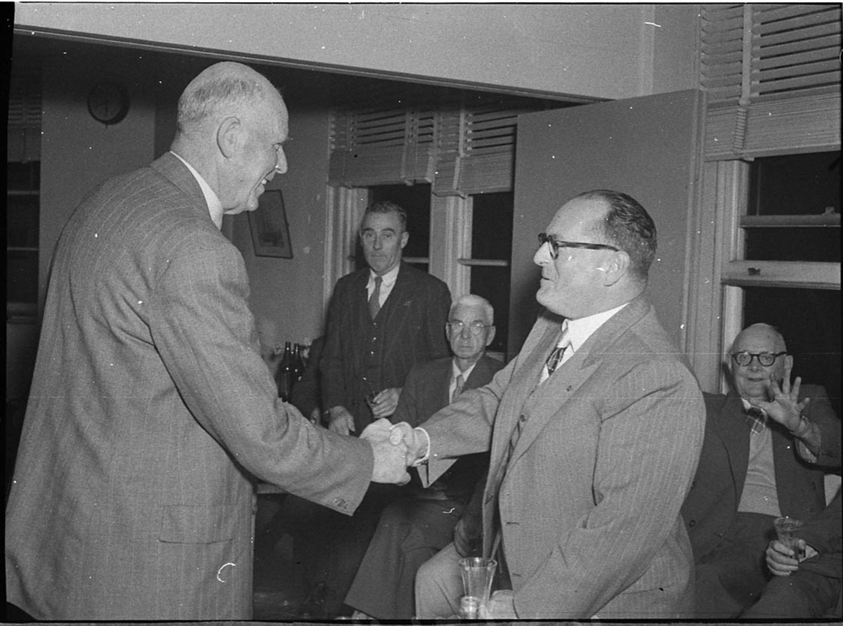 Captain D McRae one time Newcastle Harbour Master for seven years who retired as Sydney Harbourmaster in June at farewell party at Newcastle State Dockyard with Lord Mayor Ald McDougall (1956)