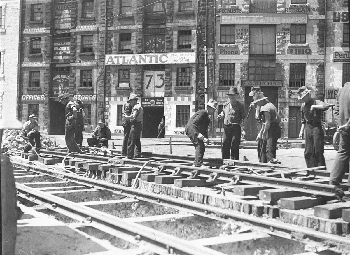 Chopping up the road at Circular Quay to lay new tramlines (1930s)