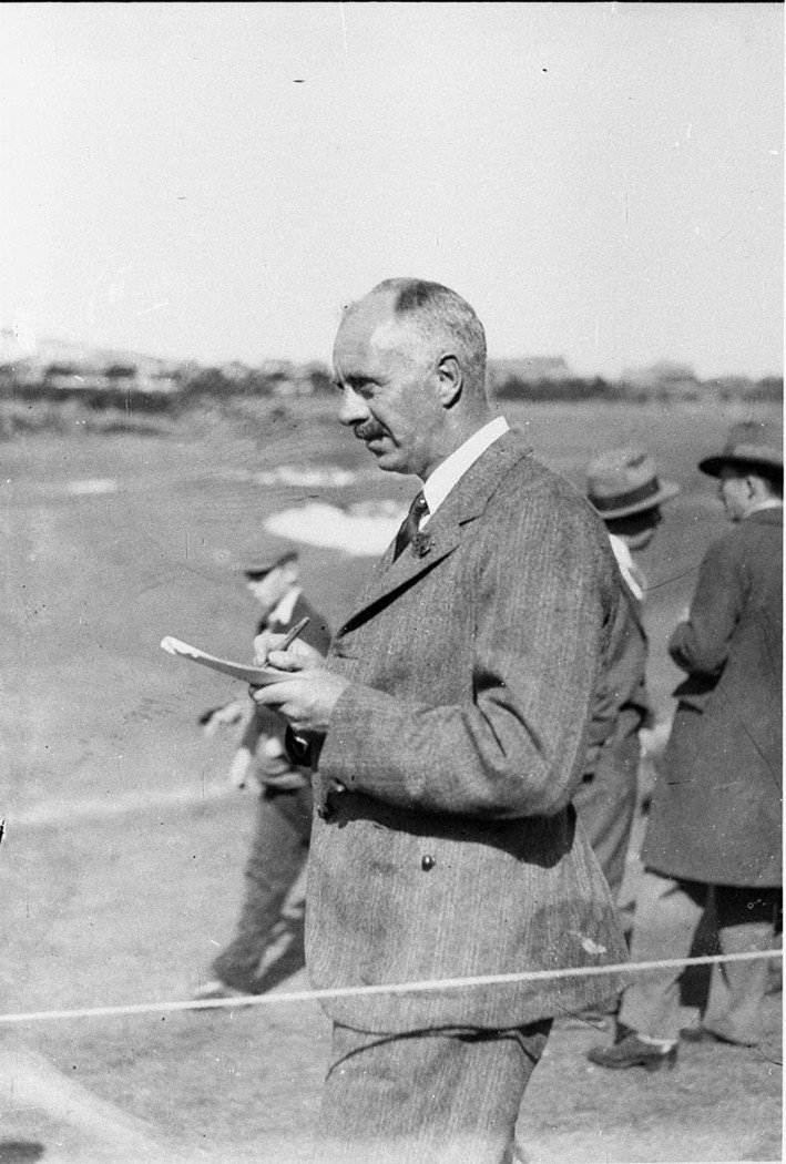 Col Bertram checking scorecard (1930s)