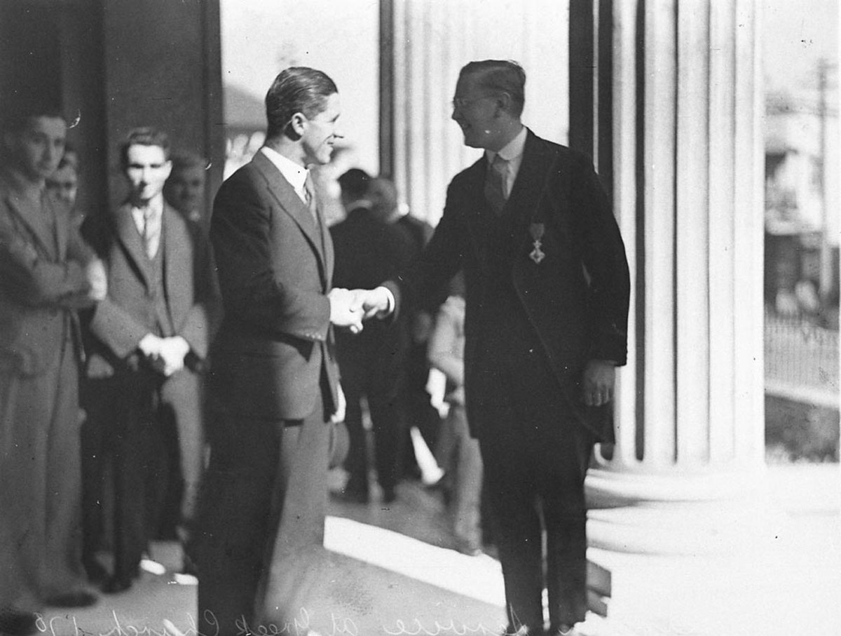 Consul greets guest at Roumania Day service at Greek Orthodox Church (1930s)