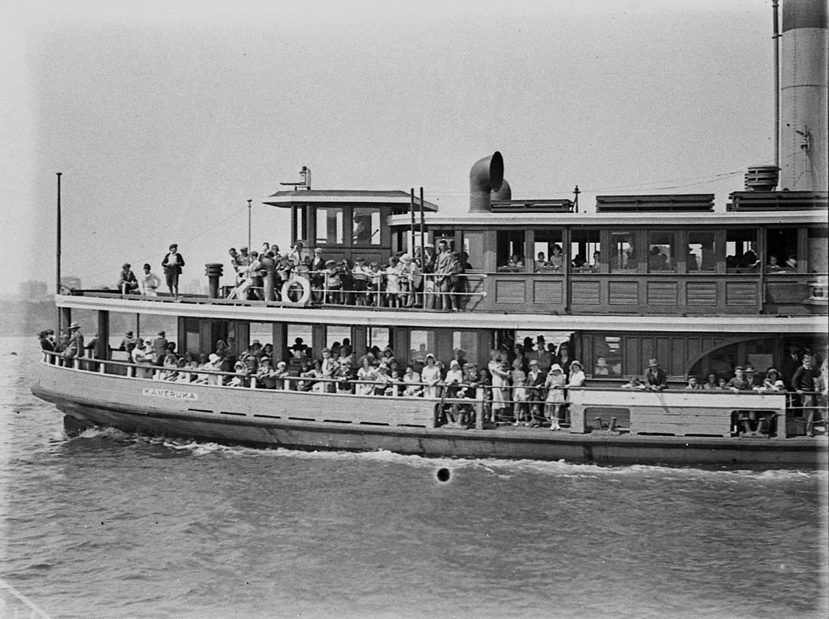 Crowded Sydney ferry Kameruka berthing at Clifton Gardens, Mosman (1930s)
