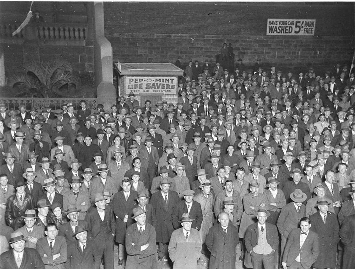 Crowds outside Central Court listening to the broadcast of third cricket test from Sam Lands Palace of Gems (1934)