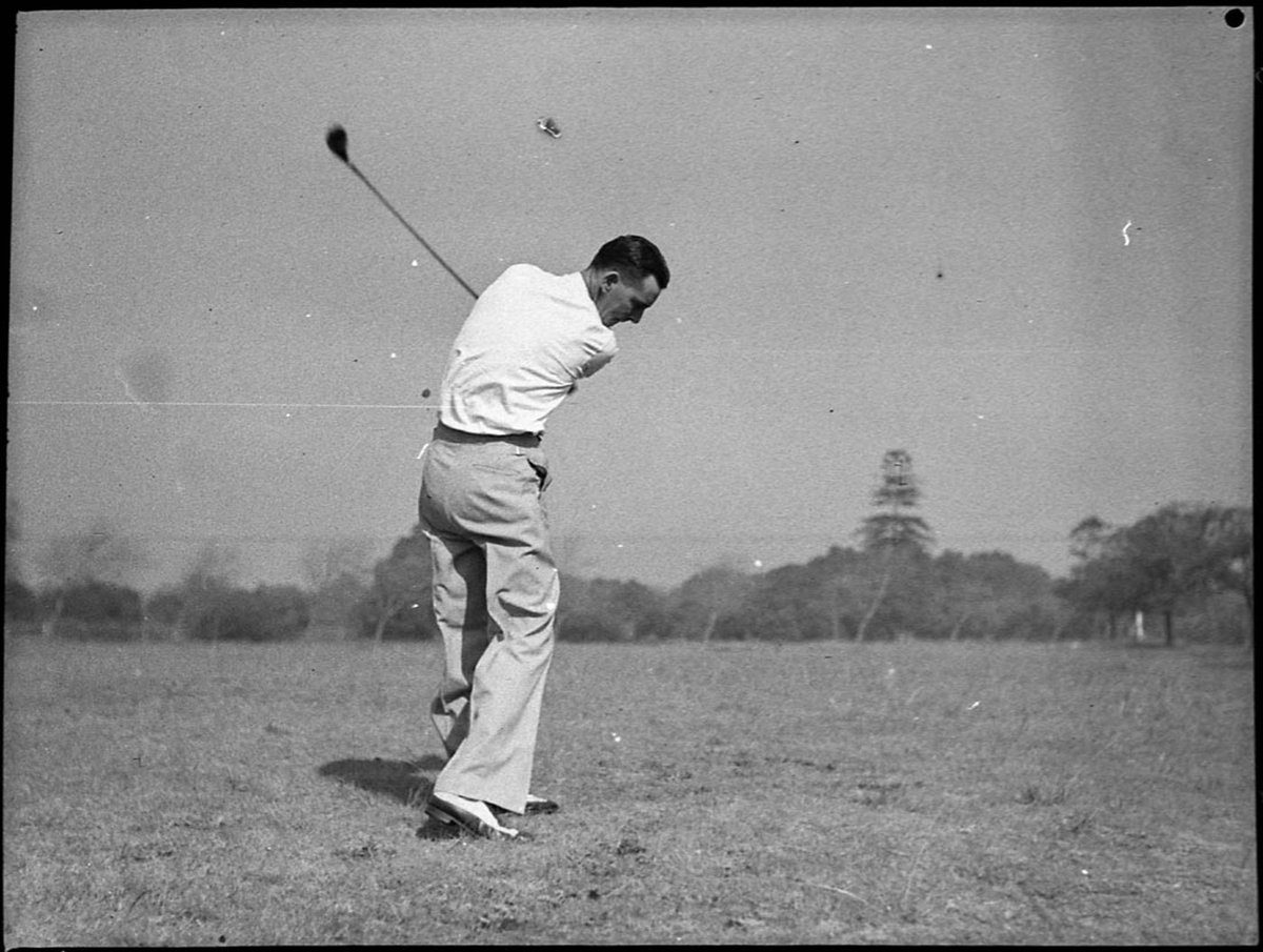 Dan Cullen demonstrating golf technique for the camera at Centennial Park taken for Golf in Australia, Moore Park (1939)
