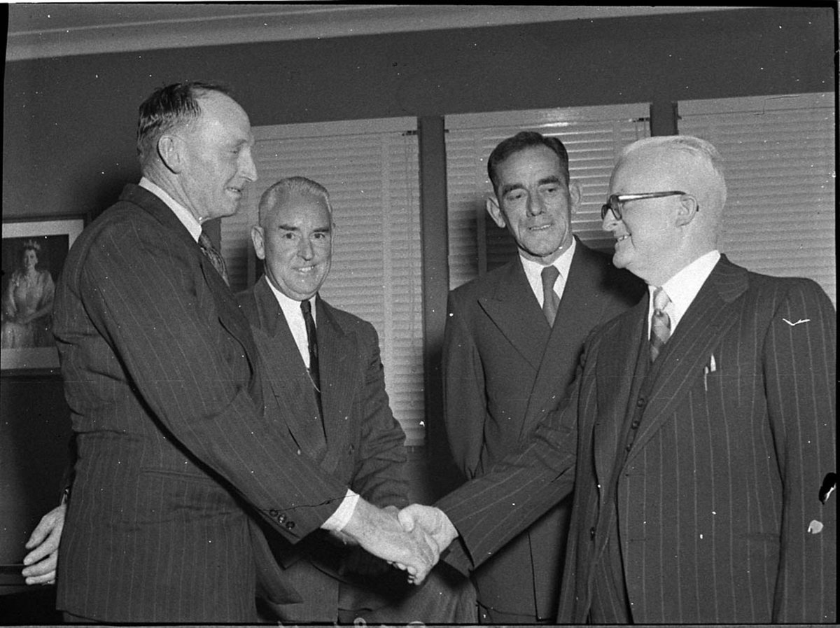 Deputy President Cr WL Quinn congratulates President Cr WL Quinn on his election Centre Cr W Wilson left Cr G Durie (1955)