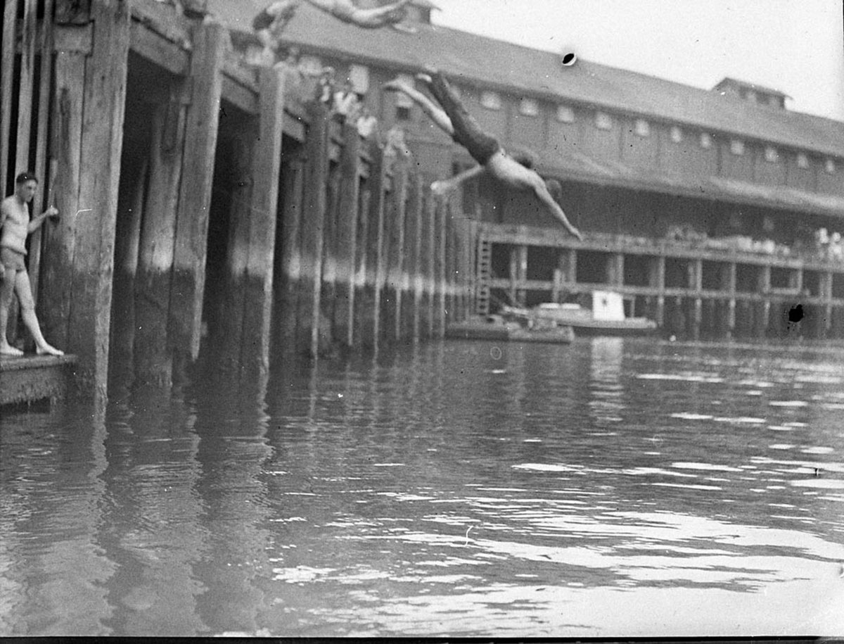 Diving from a wharf into the Harbour (1930s)