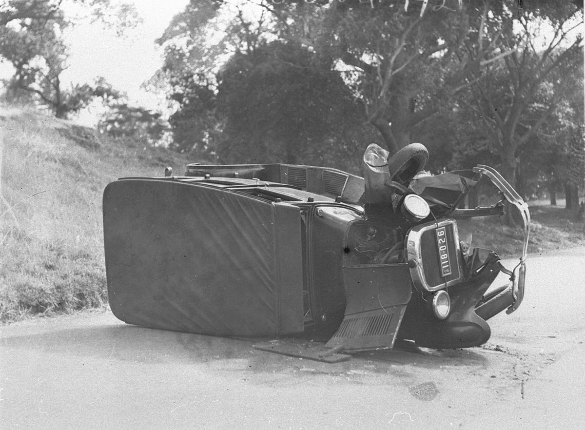 Dodge Sedan hits post in the Domain and rolls over (1930s)