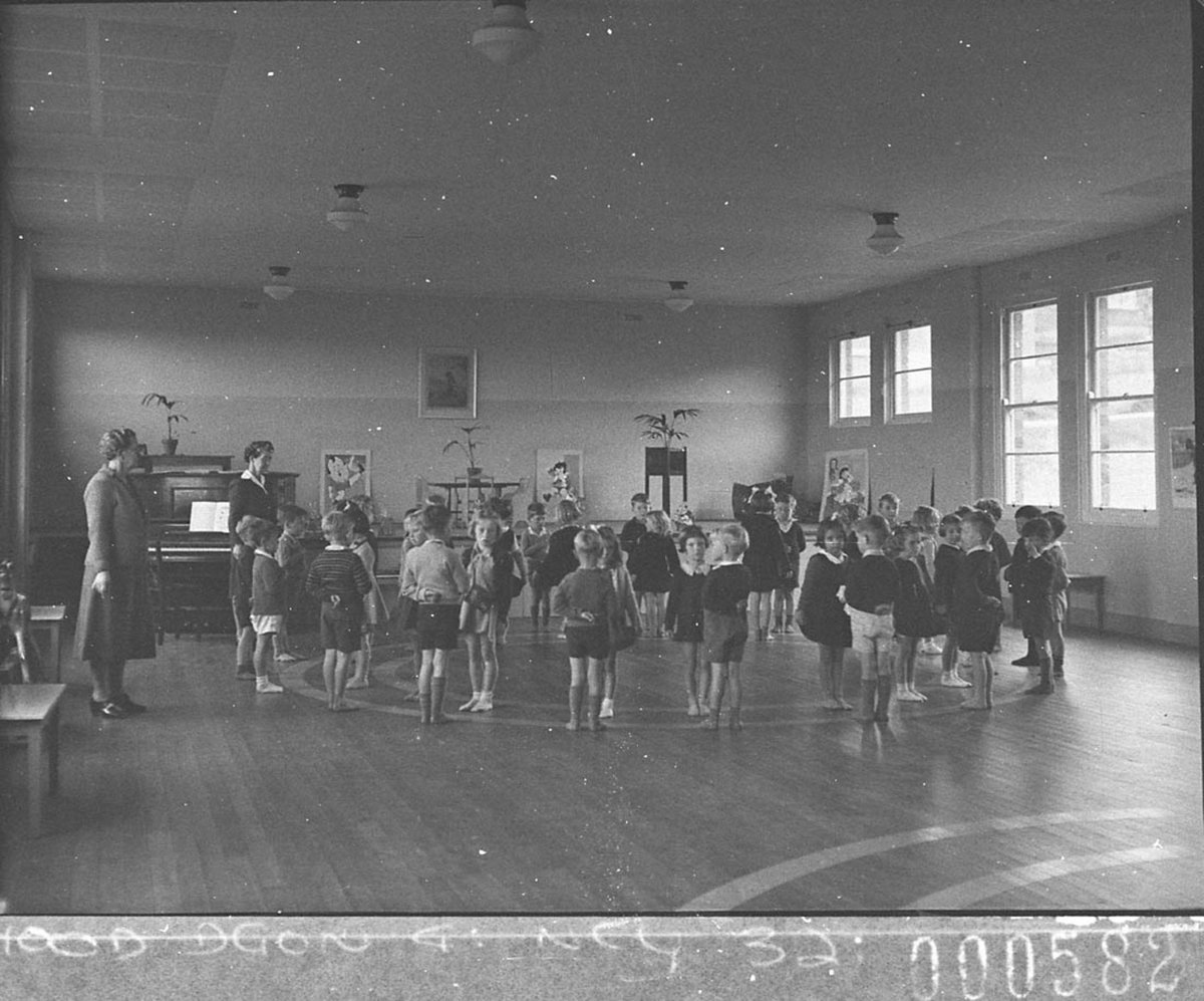 Eight year old boys and girls in a circle learning to dance Maroubra Public School taken for the Teachers Federation (1946)