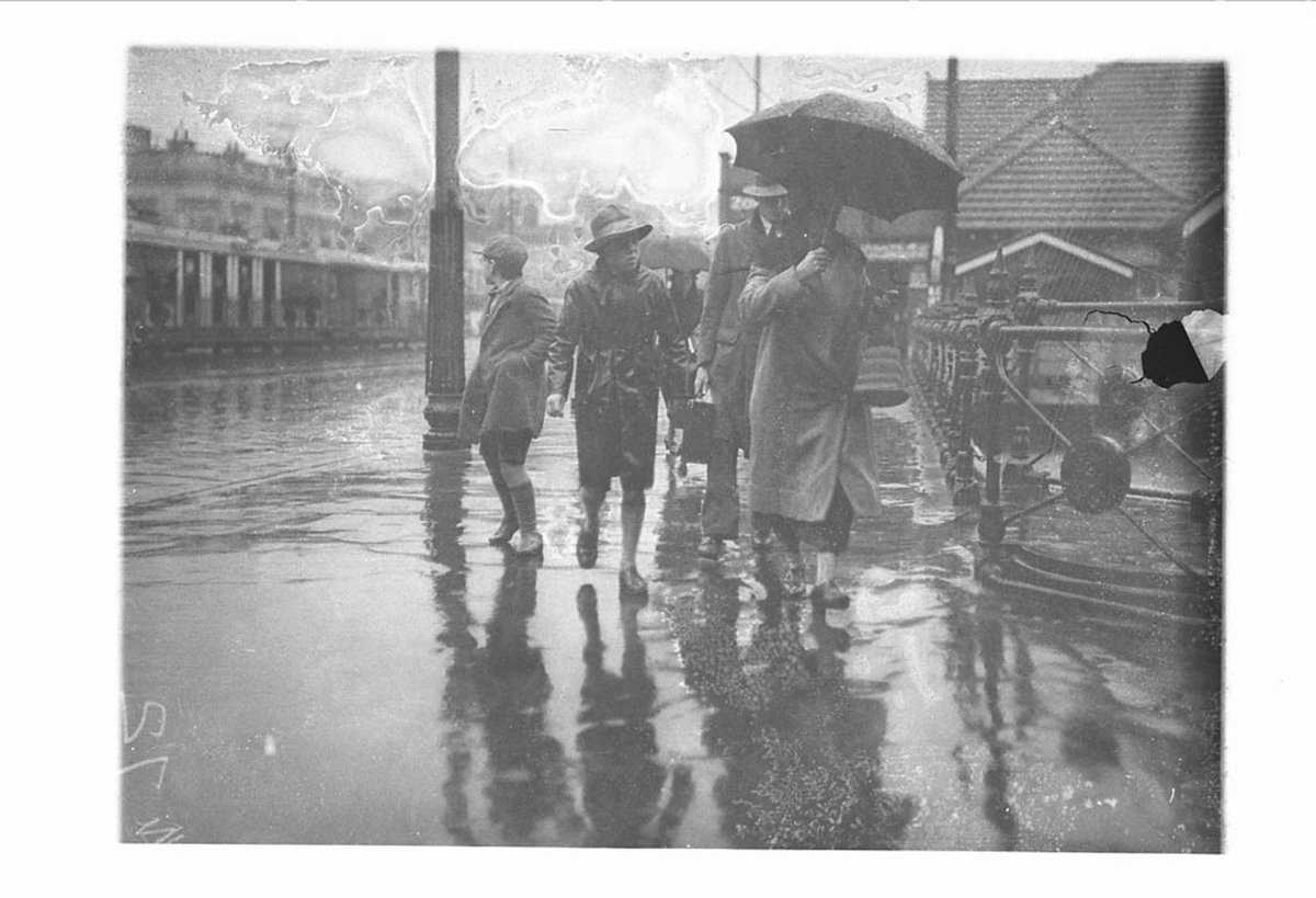Family in the rain Circular Quay (c. 1930)
