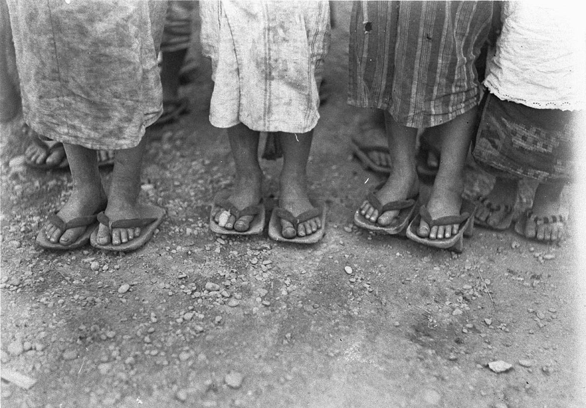 Feet of Chinese labourers showing wooden thongs (1925–57)
