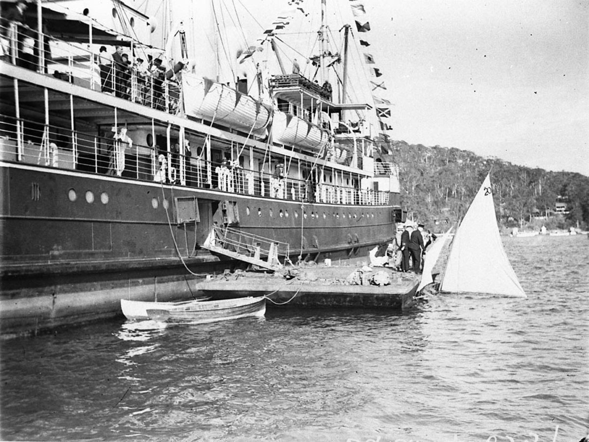 Flagship Gwydir showing boarding pontoon moored beside (1930s)