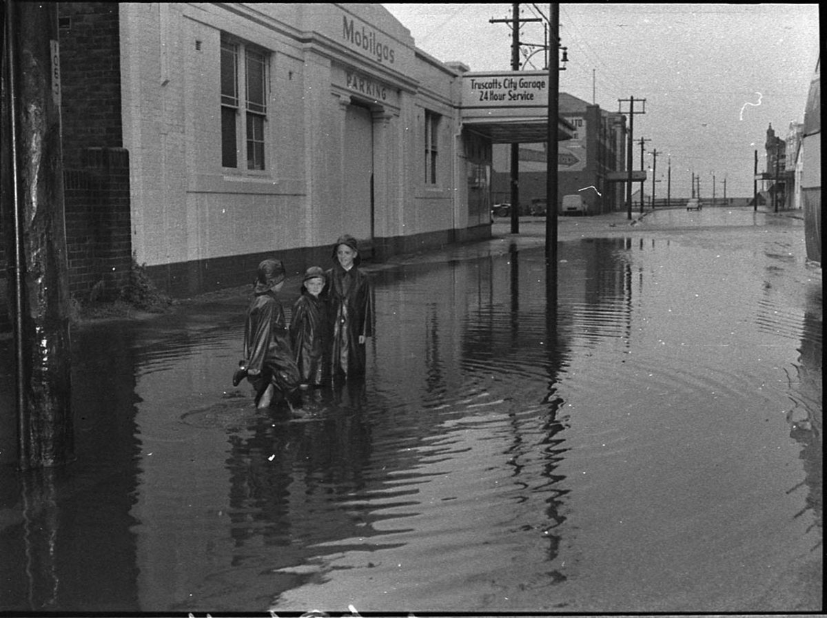 Flooded streets during wet weather (1956)