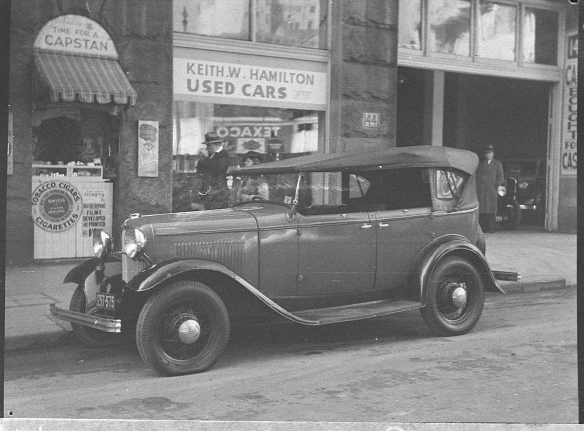 Ford B Model in front of Keith W Hamilton used cars 1937