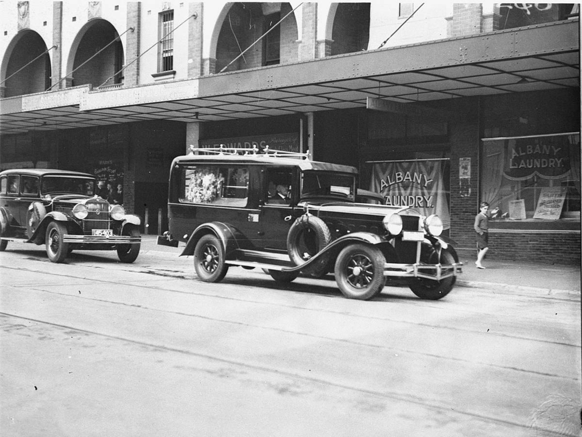 Funeral cars at Motor Funerals Parlour in George Street, Sydney city centre (1930s)