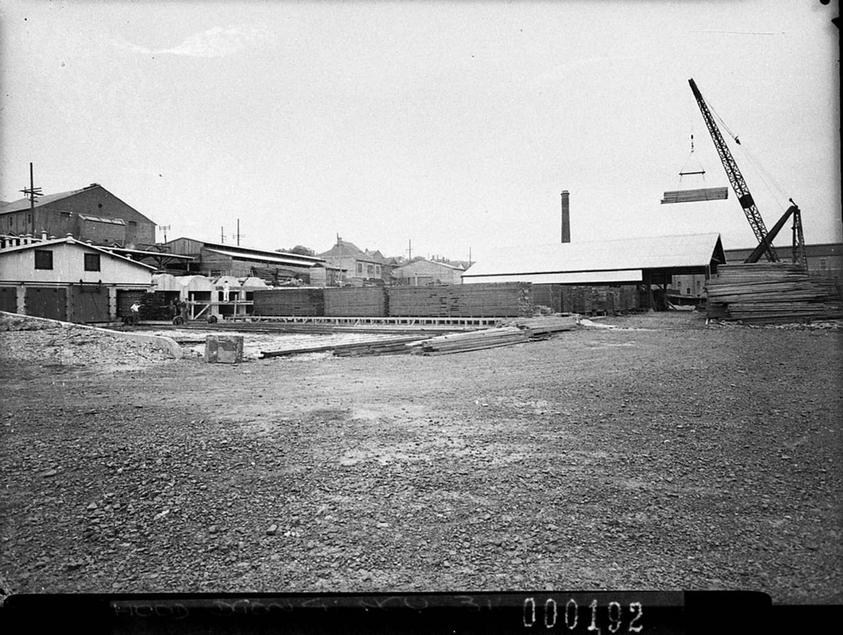 General view of the whole yard crane lifting billet of timber, Balmain (1940)