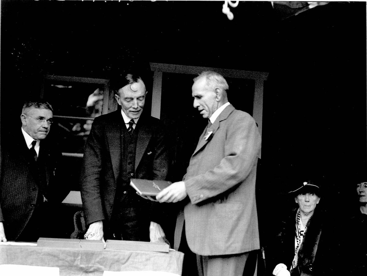 Governor Game receiving illuminated address from Mr Drummond (1934)