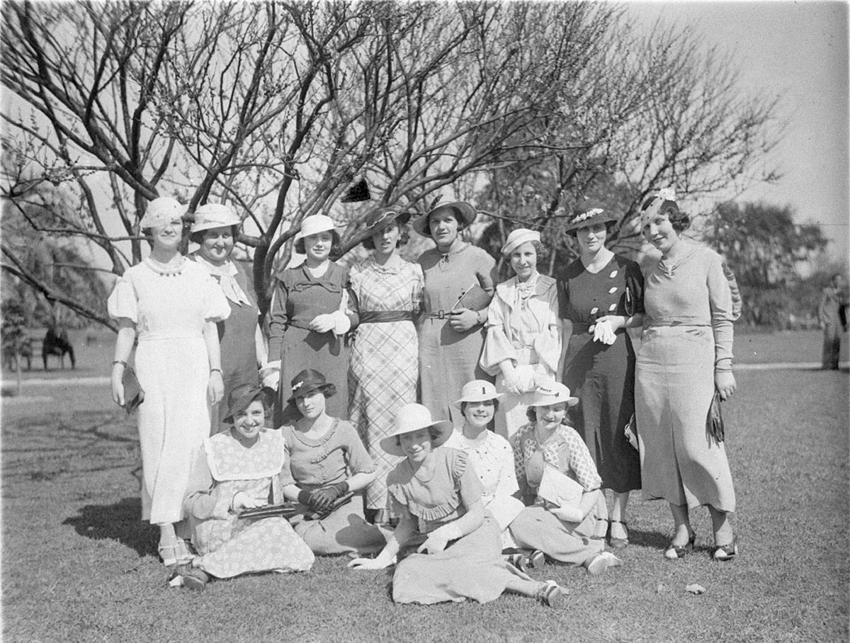 Group of thirteen young women on the lawn (c. 1934)