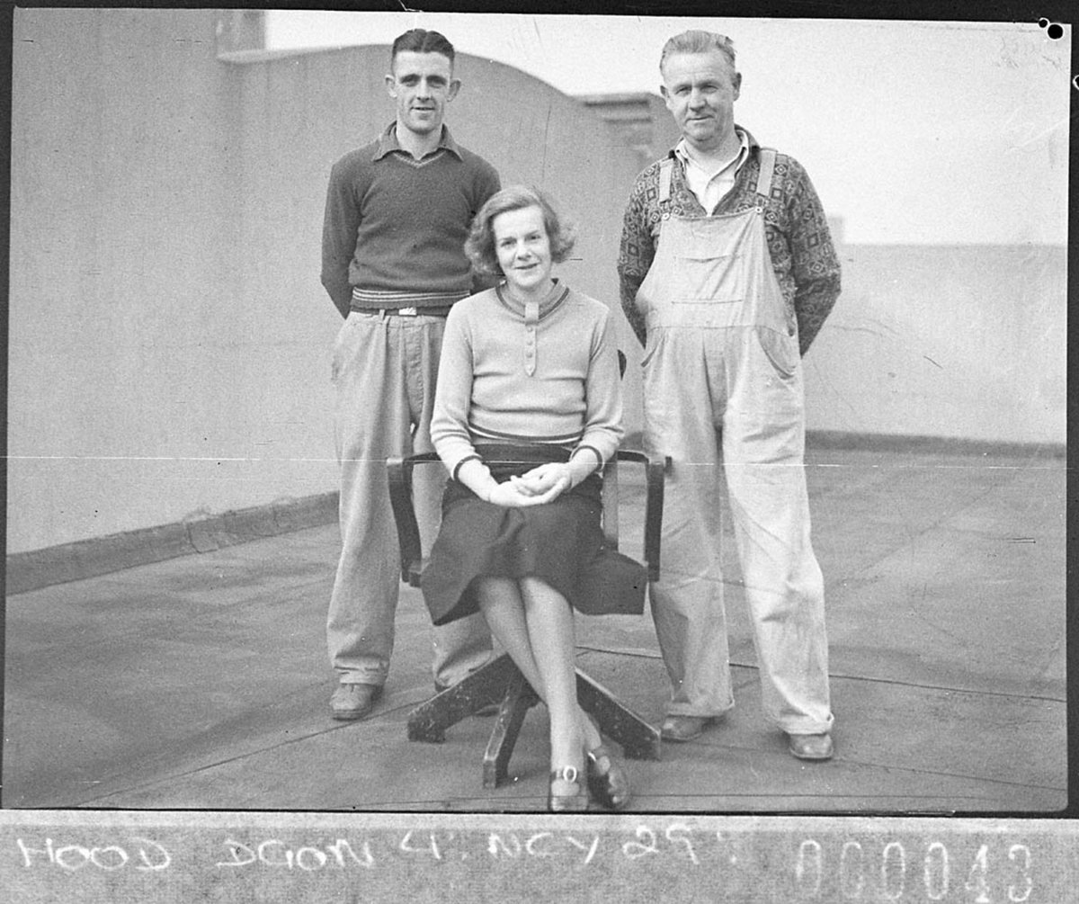 Group of two men and a woman maintenance staff on the roof of Veals Ltd (1937)