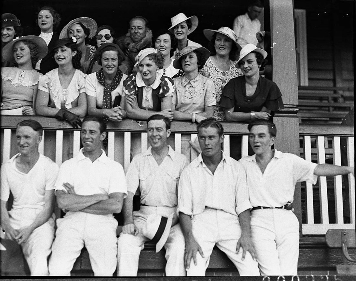 Group of women cricket barrackers with five cricketers (1935)
