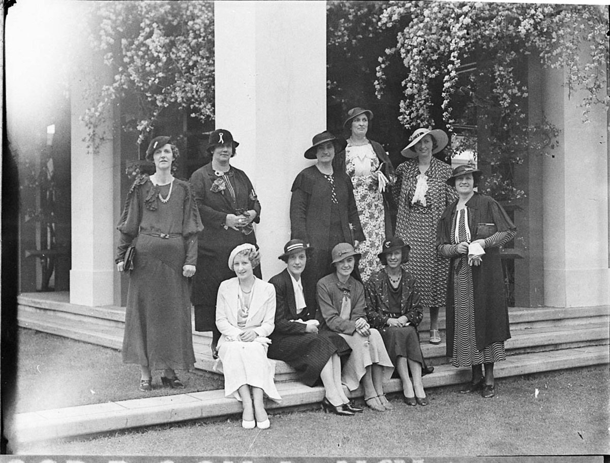 Group of women on the porch of a mansion (1940)