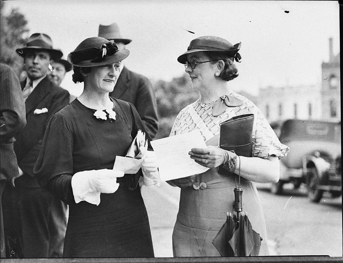 Justices of the Peace sworn in Two women holding papers outside Court of Quarter Sessions (1935)