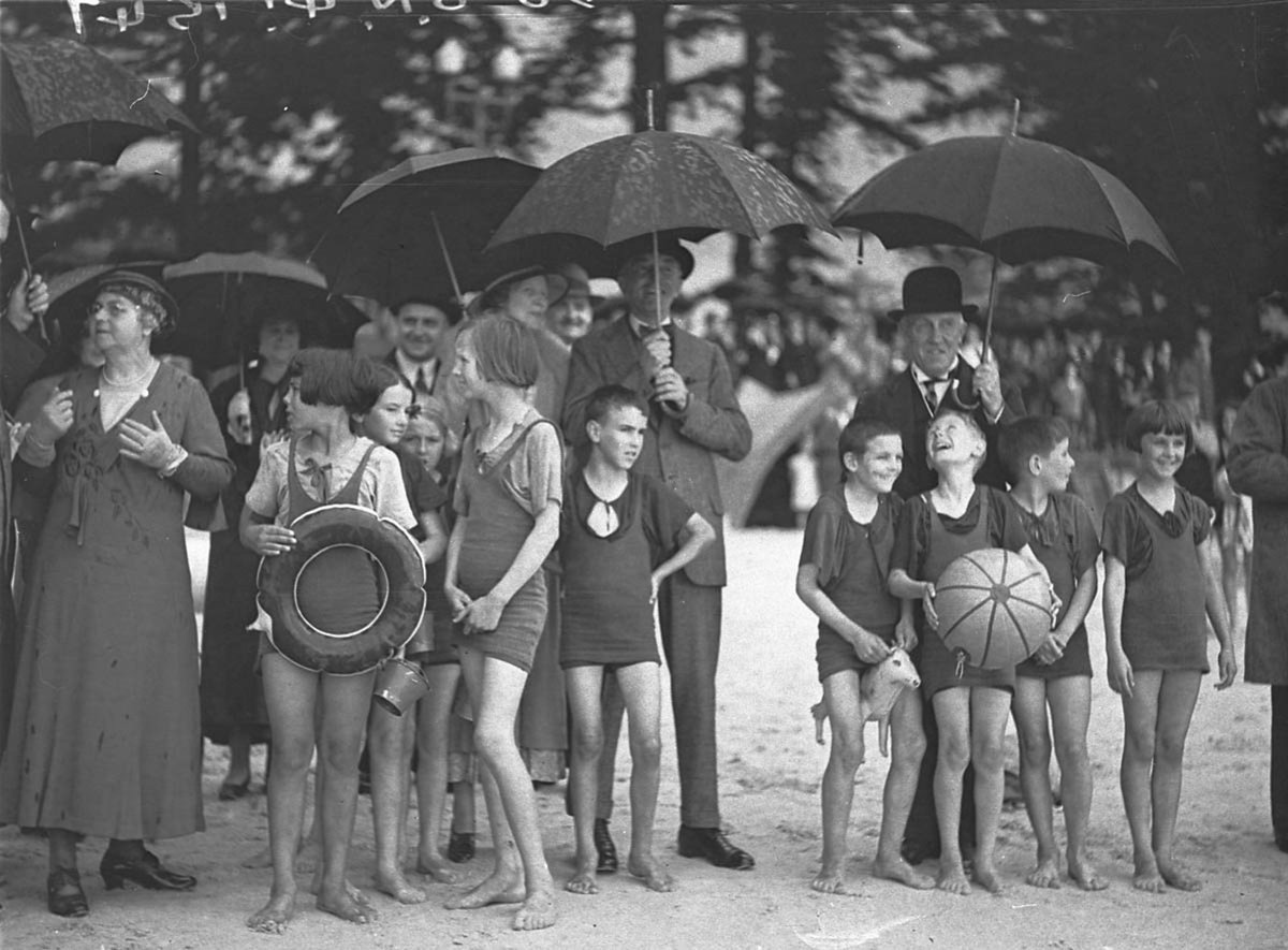 Kids in their bathers in heavy rain (1930s)