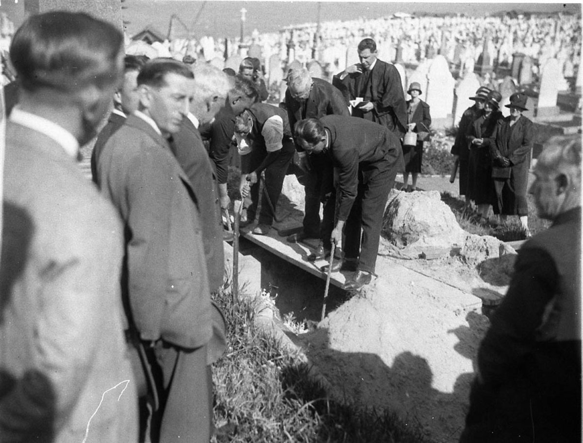 Lowering the coffin into the grave (c. 1930)
