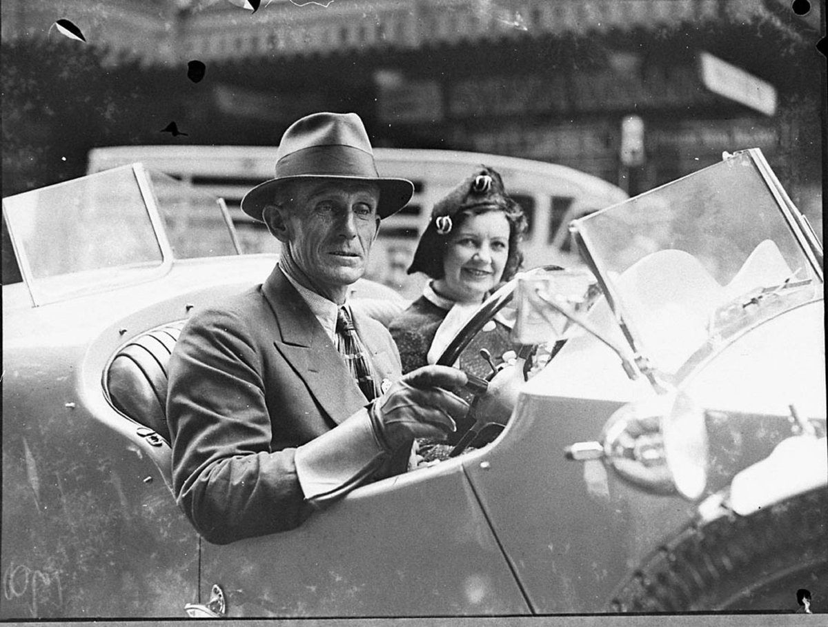 Man and celebrity woman in a Vauxhall Hurlingham sports car (1935)