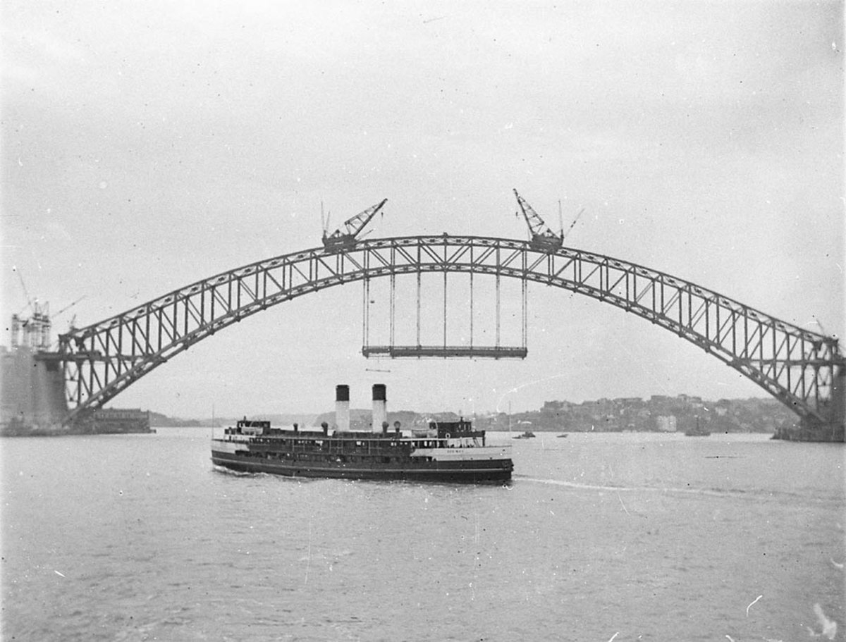 Manly Ferry Dee Why passes near partcompleted Harbour Bridge, Sydney Harbour (c. 1932)