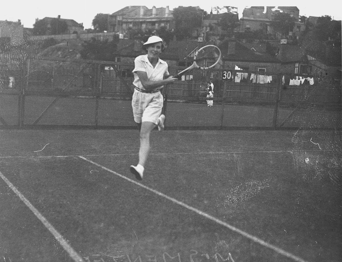 Mrs Menzel playing tennis in shorts (1934)