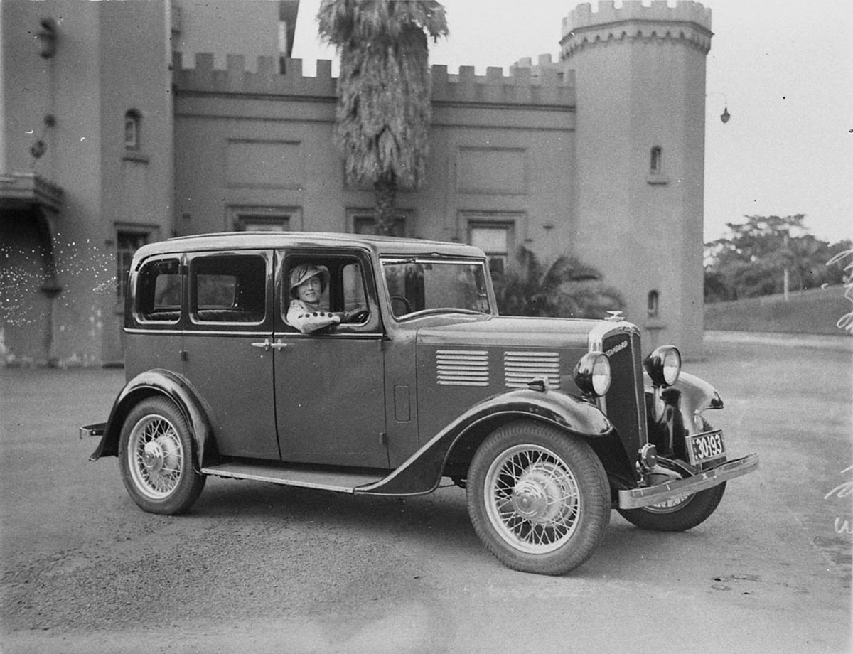 Mrs Stilling at wheel of her car at Conservatorium, Sydney city centre (1930s)