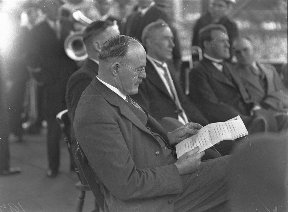 NSW Premier JT Lang reading a document good profile, Sydney (1930s)
