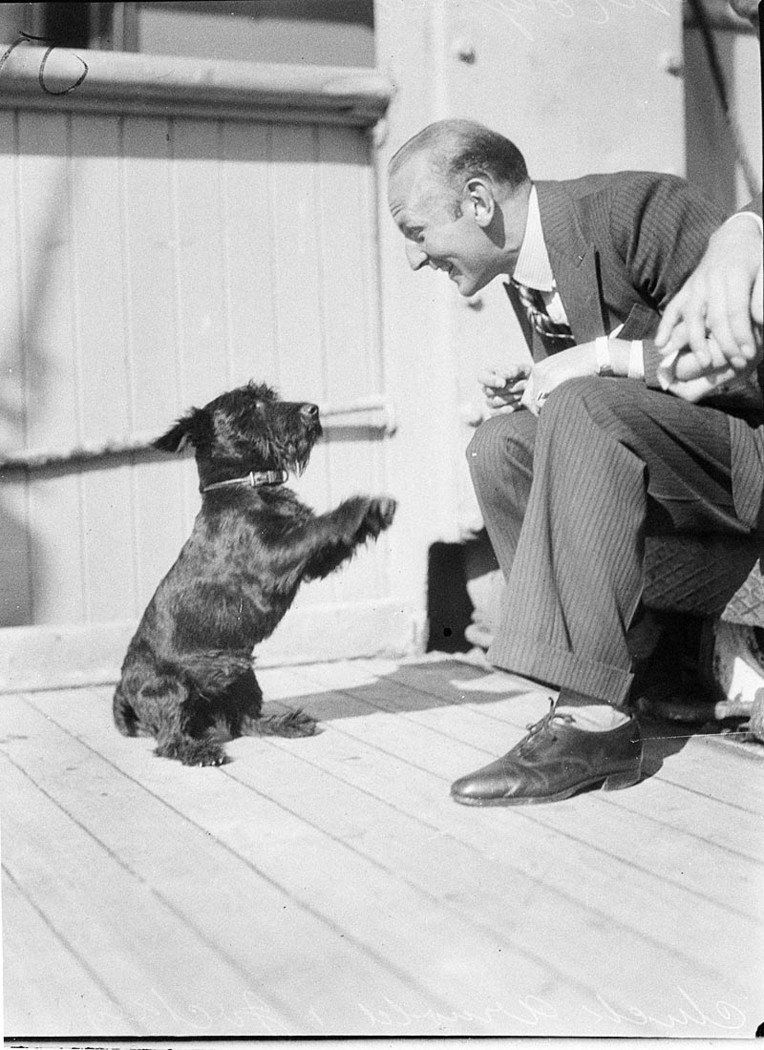 On the ship Mongolia Chuck Arnold and Jockey dog (1930s)