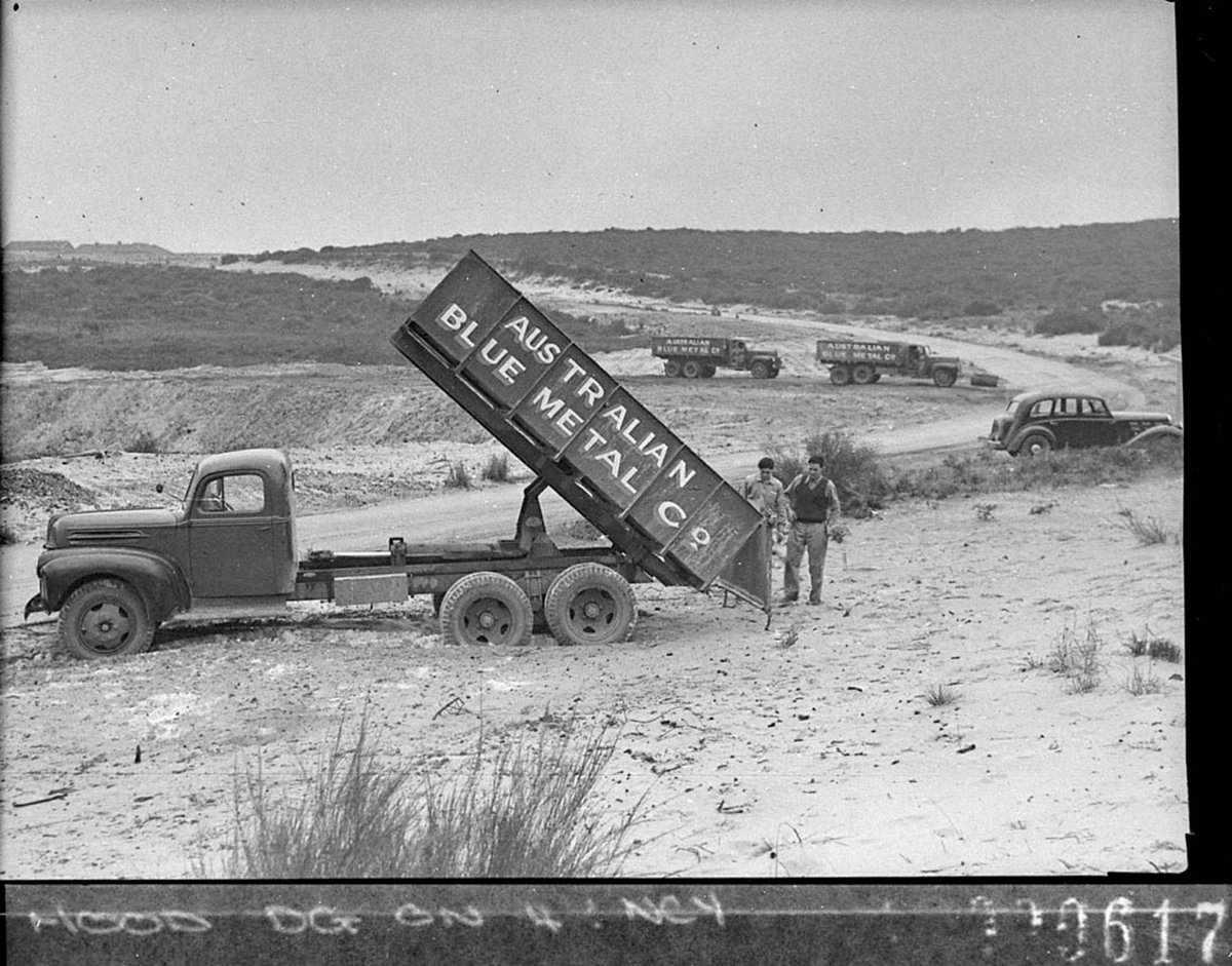 One of the trucks tipping its load Australian Blue Metal Co trucks for Mr Freeman Ford News (1944)