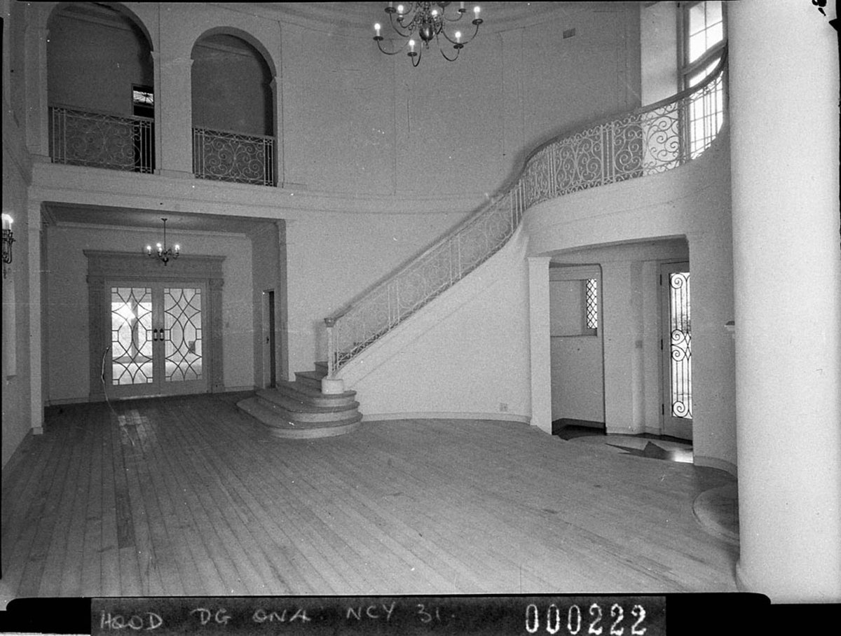 Part of the entrance hall showing the metal balustraded stairway Burnham Thorpe Gordon home of Mr Woolcott Forbes (1940)