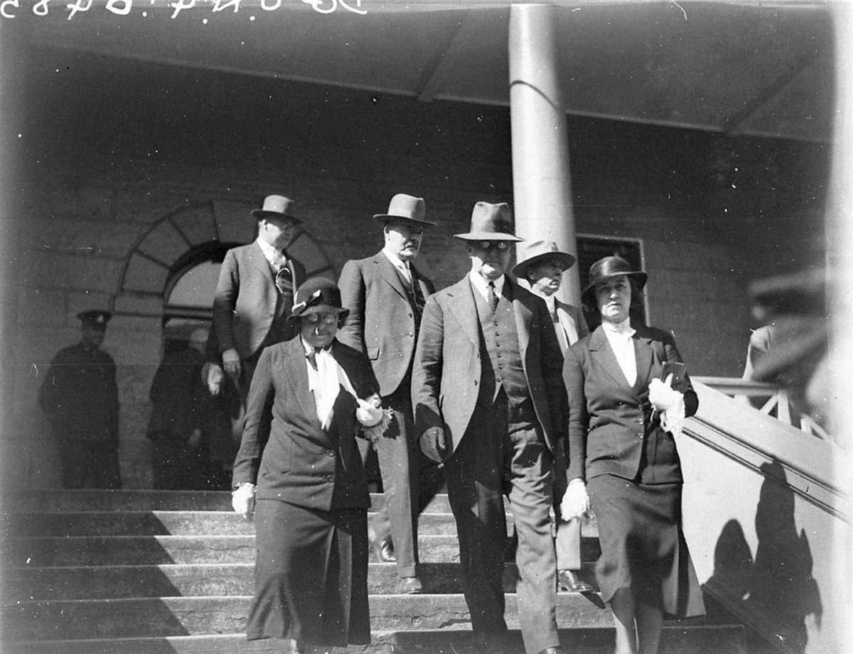 Premier Jack Lang centre leaving Parliament House, Sydney city centre (1930s)